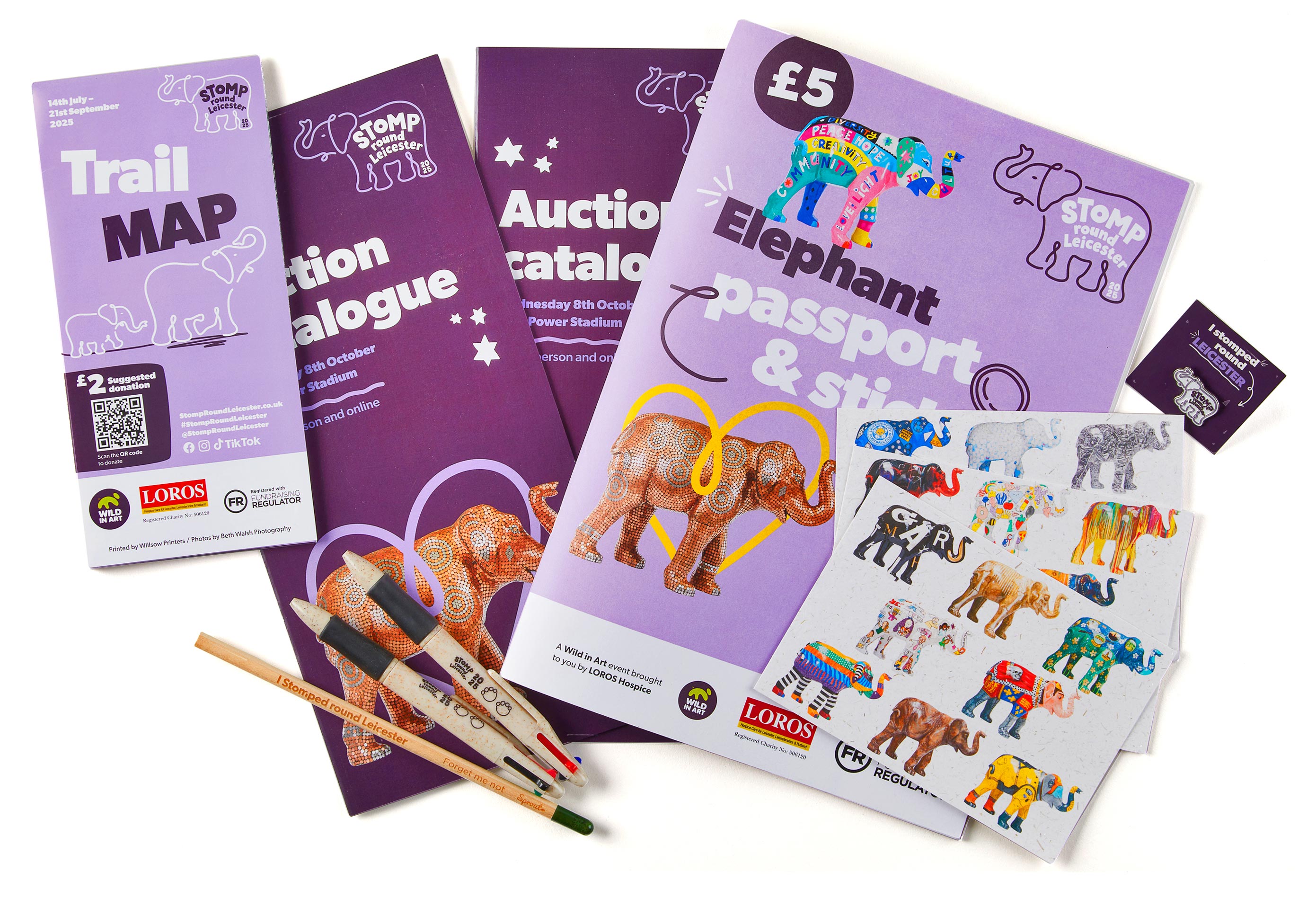 A collection of Stomp Round Leicester merchandise, including Pens, pencils, pin badges and programmes. Shot by Stocks Taylor Benson, in our in-house studio.